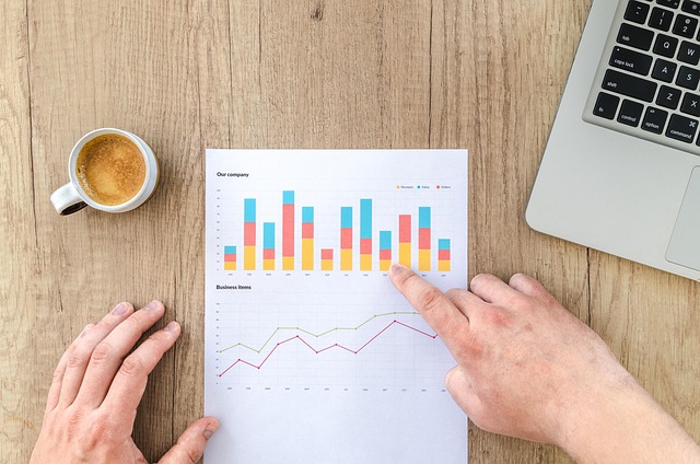 pricing comparison for investment research plans on a desk with notebook